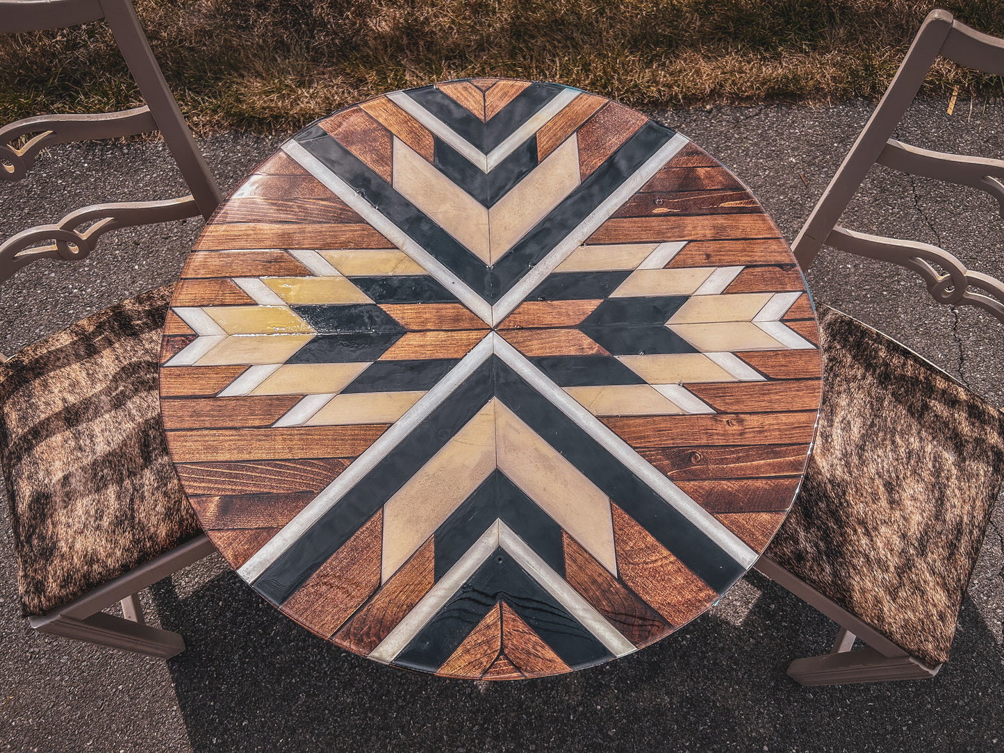 Round mosaic table with cowhide chairs