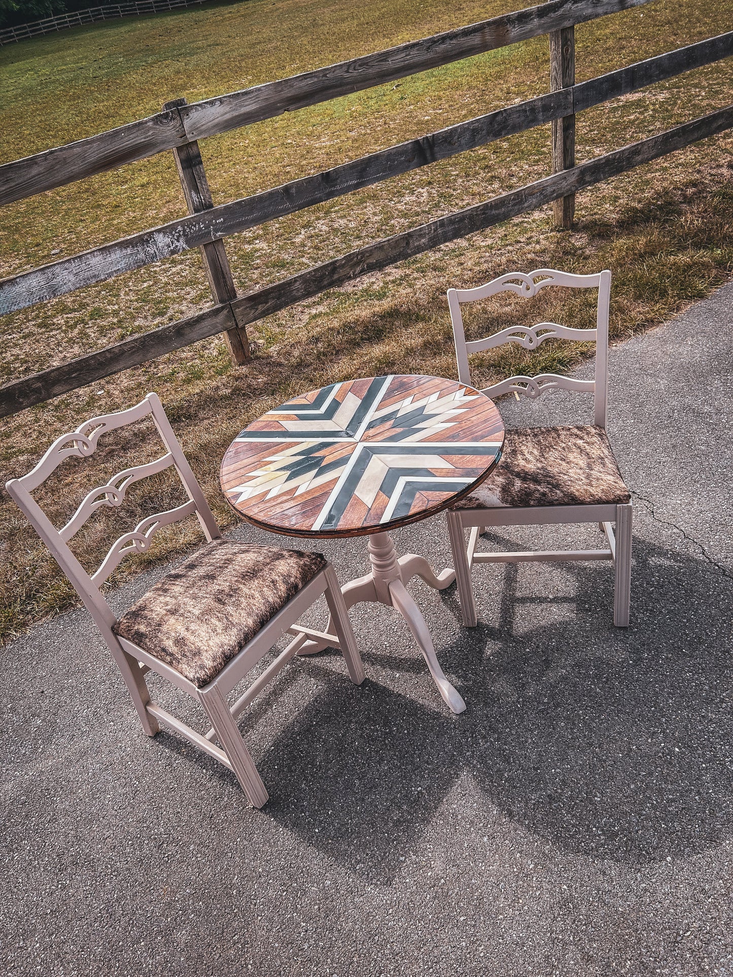 Round mosaic table with cowhide chairs